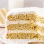 coconut cake with slices missing so you can see the interior