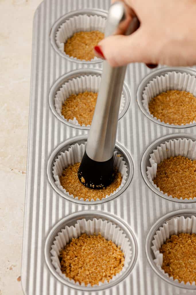 graham cracker crust pressed into muffin liners