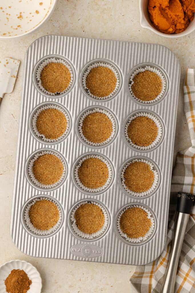 graham cracker crusts pressed into muffin liners