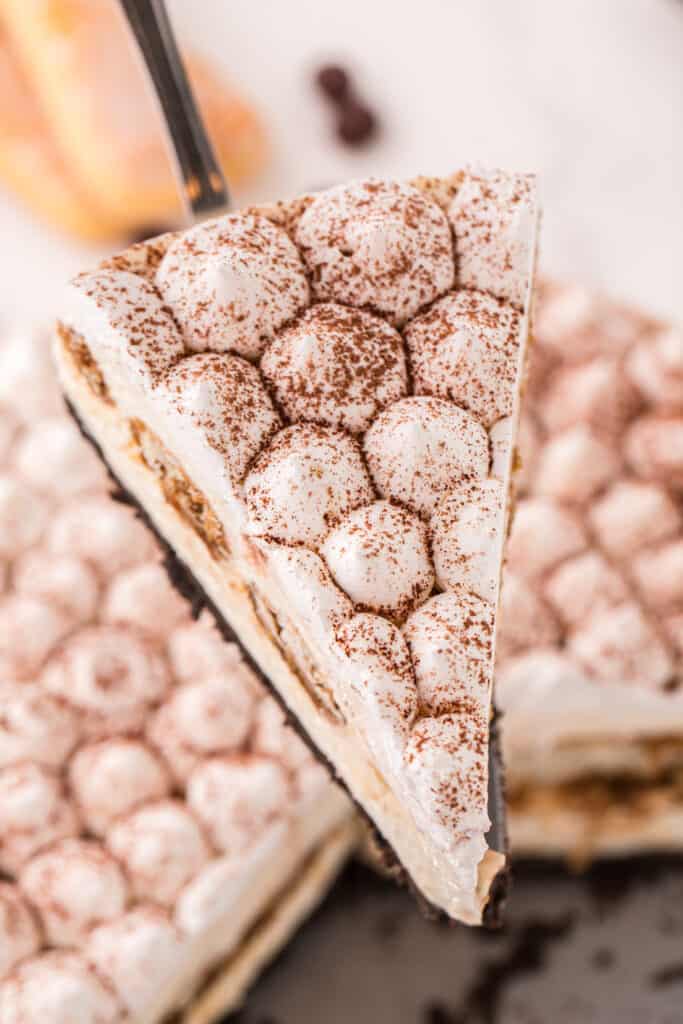 cake server with a slice of Tiramisu cheesecake on it
