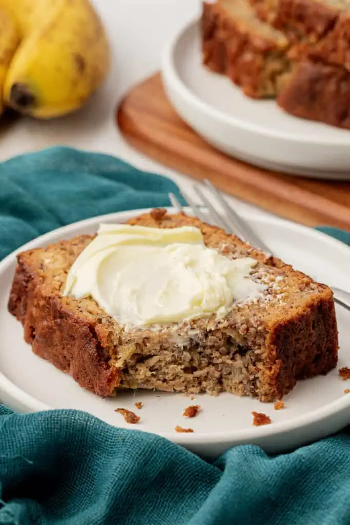 slice of buttermilk banana bread topped with butter