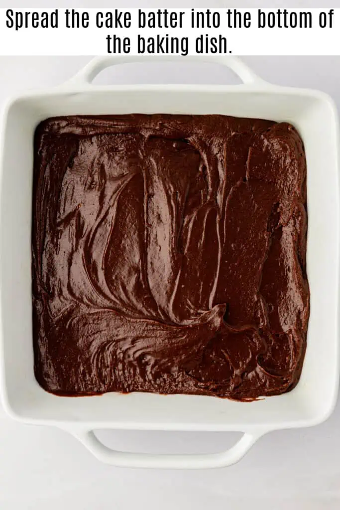 chocolate cobbler cake batter in a baking dish