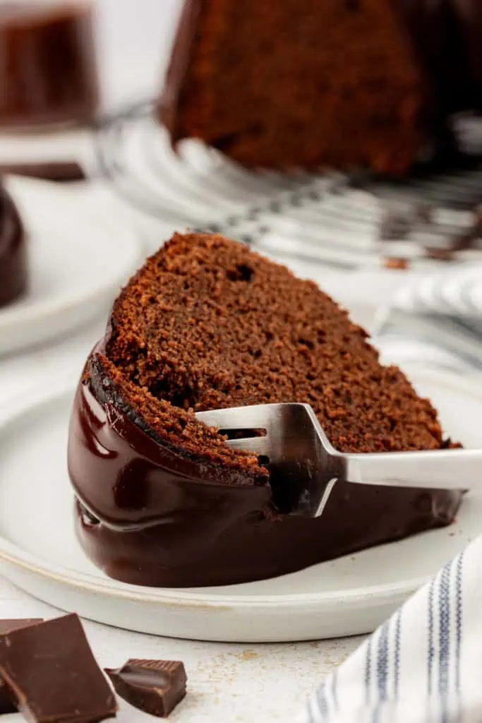 fork cutting into a slice of chocolate pound cake