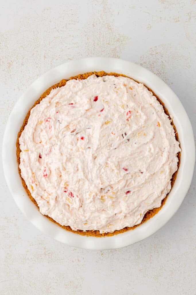 millionaire pie mixture spread into graham cracker crust