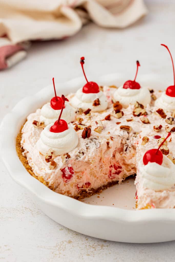 whole millionaire pie in a pie plate with a piece missing