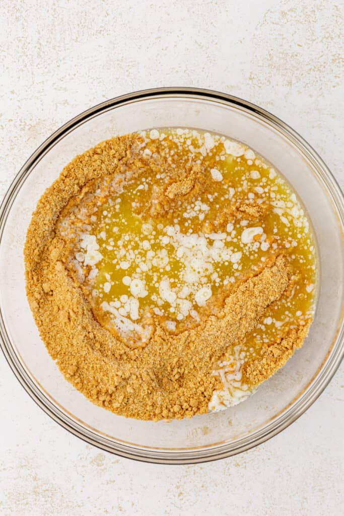 graham cracker crumbs, melted butter and sugar in a bowl