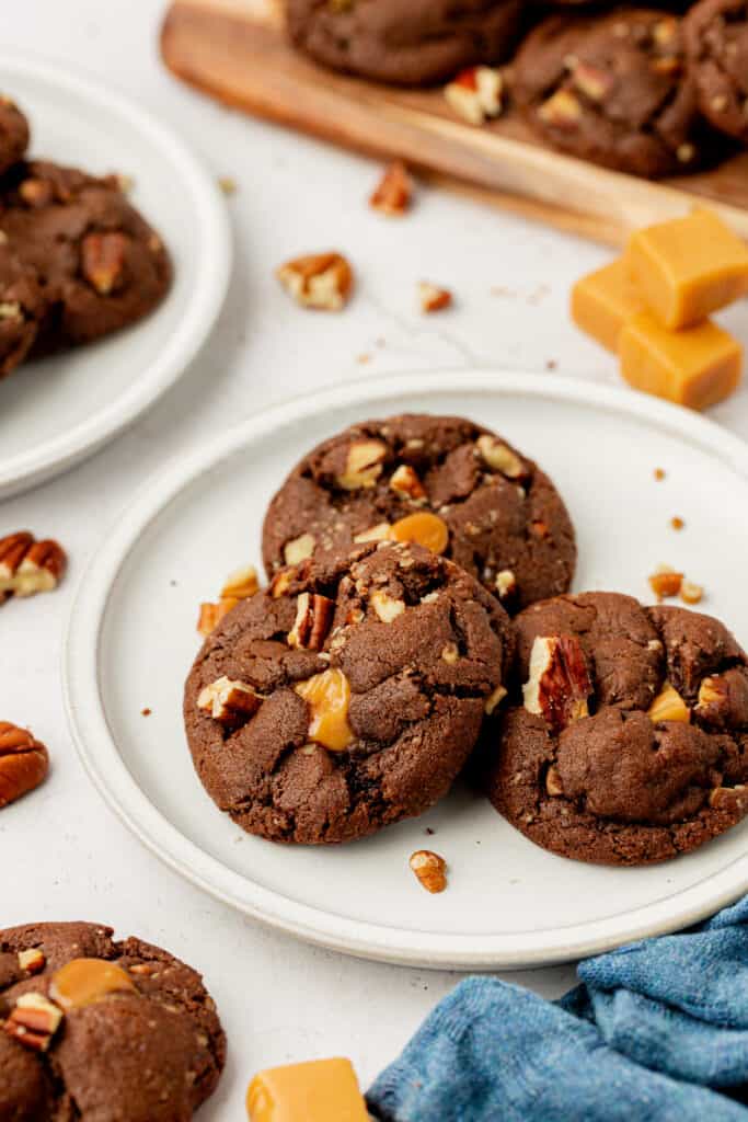a plate of chocolate turtle cookies