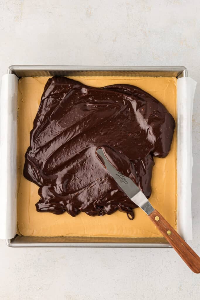 ganache spread on top of buckeye brownies