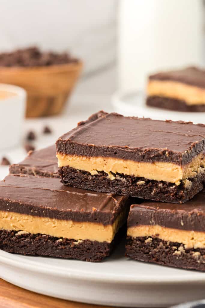 three Buckeye brownies stacked on a plate