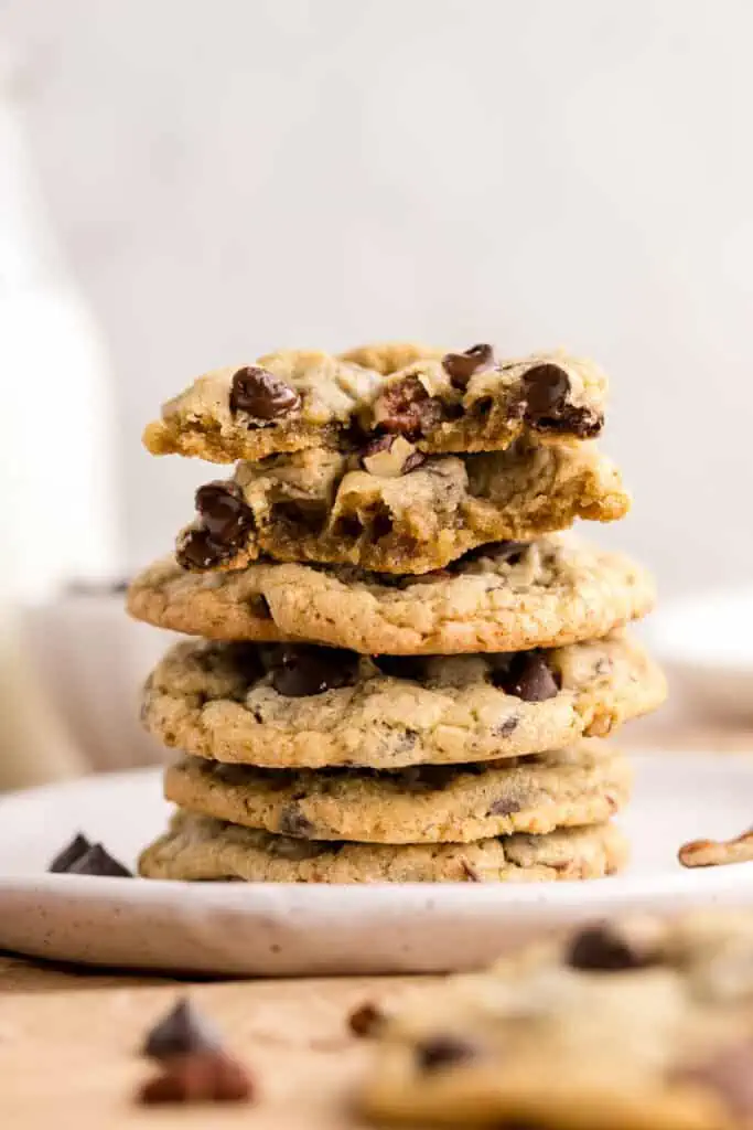 chocolate chip pecan cookies stacked on a plate