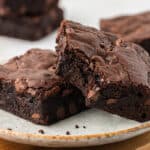 two brown butter brownies on a plate