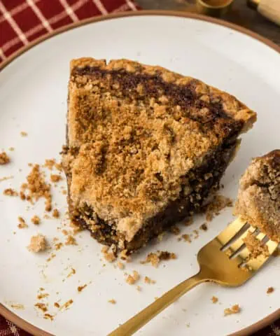slice of shoofly pie and a fork on a plate