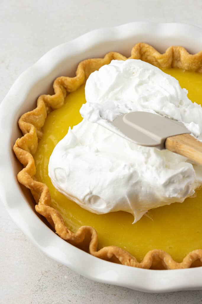 meringue spread on top of lemon filling
