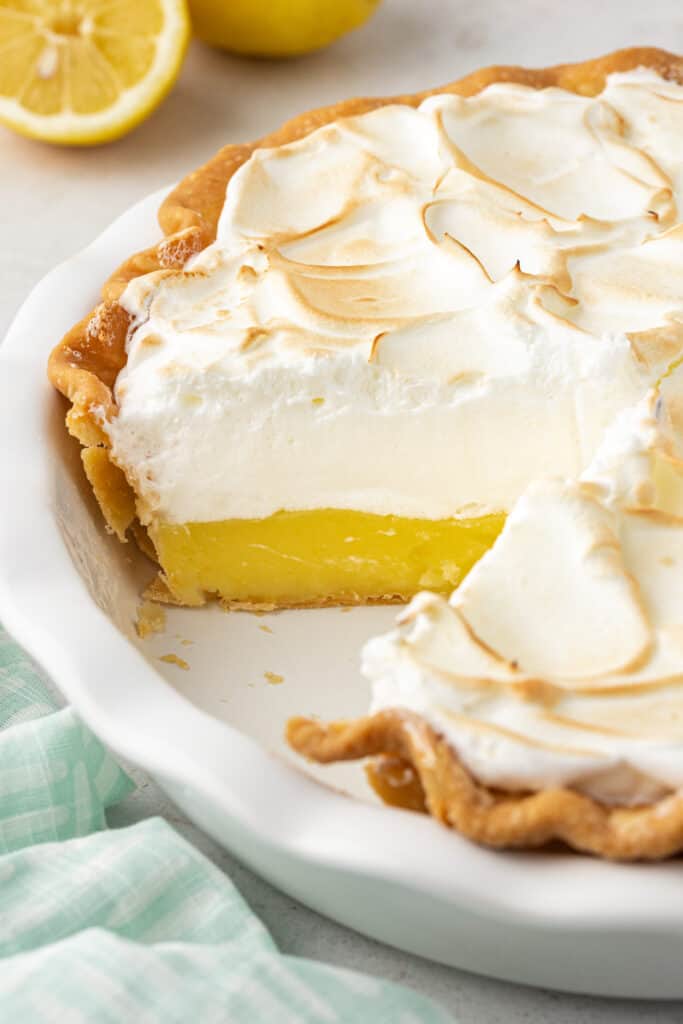 lemon meringue pie with a piece missing