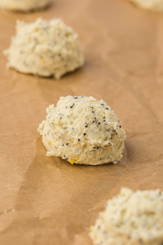 lemon cookie scooped onto baking sheet