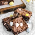 three cadbury mini egg brownies on a plate