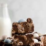 three pieces of cadbury mini egg fudge stacked on top of each other