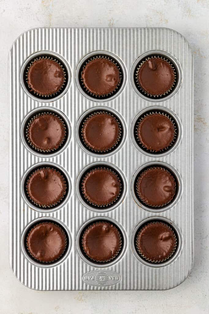 baked mini chocolate cheesecakes in muffin pan