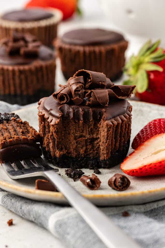 mini chocolate cheesecake and a fork on a plate