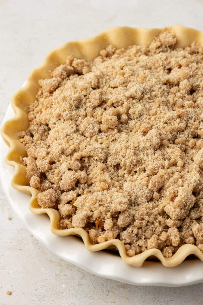 crumble topping added to top of peach pie