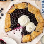 whole blueberry galette topped with vanilla ice cream