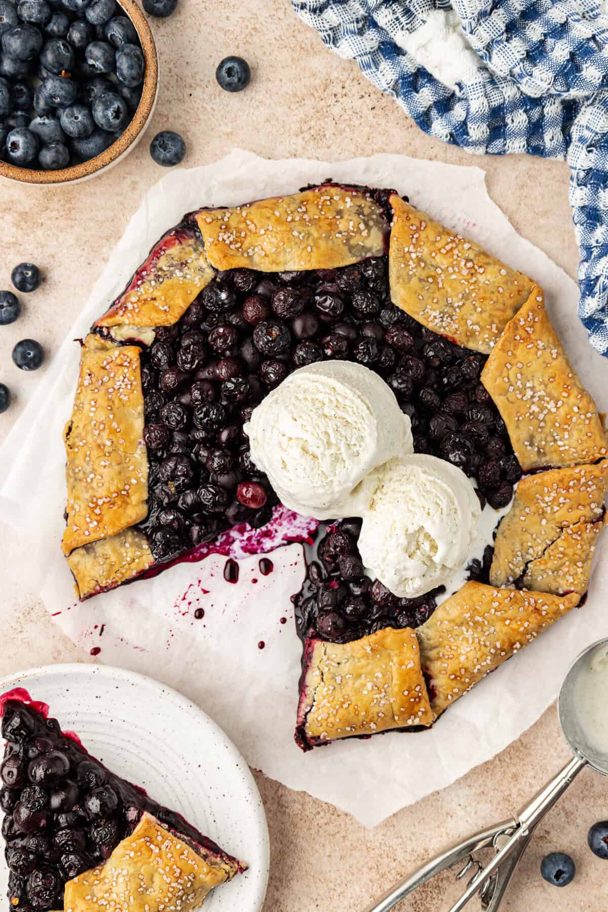 whole blueberry galette topped with vanilla ice cream