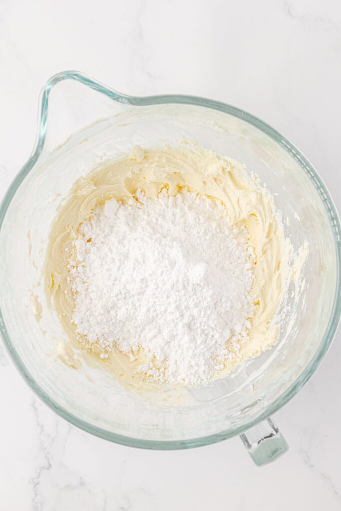 powdered sugar added to frosting mixture