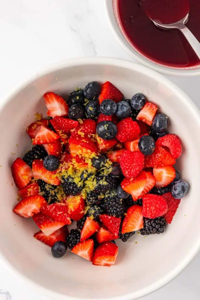 berries, lemon zest, and lemon juice in a bowl