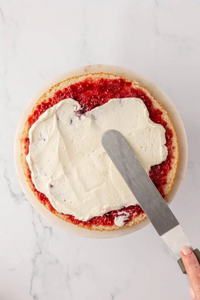 chantilly frosting spread onto cake layer