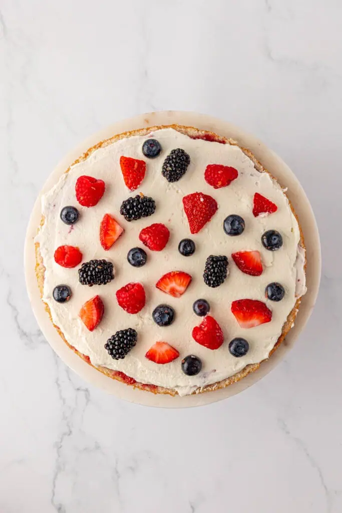 berries placed on top of frosting