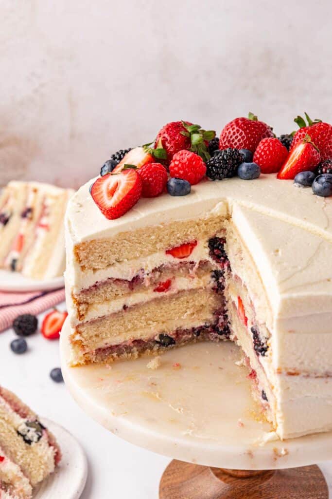 whole Chantilly cake with a slice missing
