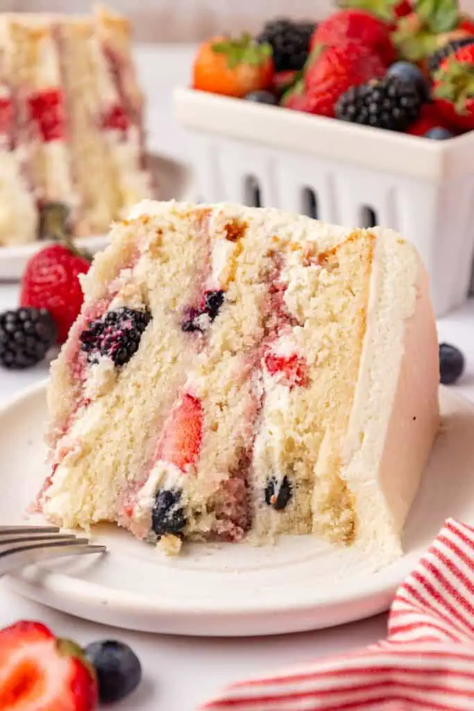 slice of chantilly cake with a bite missing