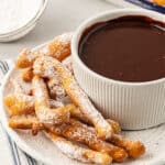funnel cake fries on a plate with chocolate sauce