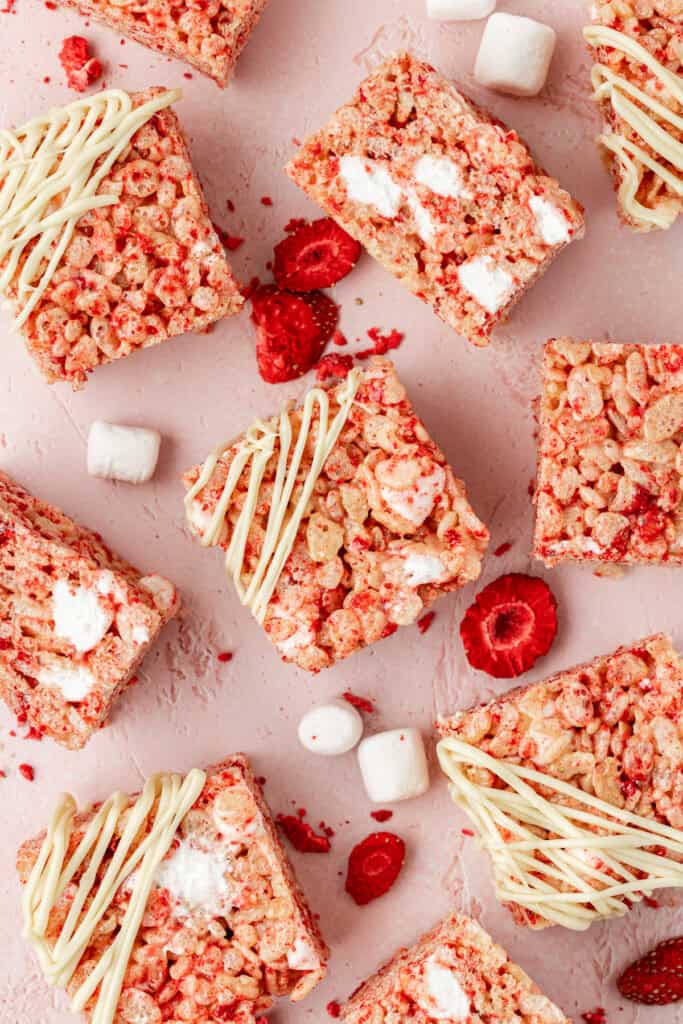 white chocolate strawberry rice krispie treats scattered around