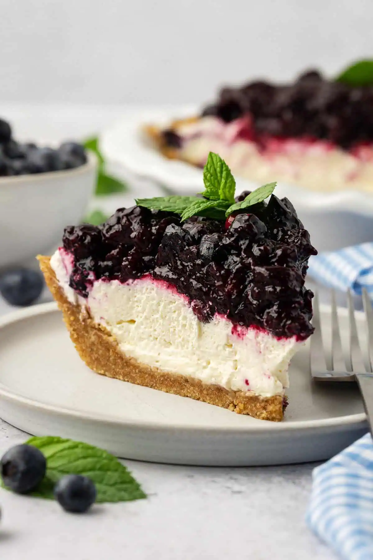 slice of blueberry cream cheese pie on a plate