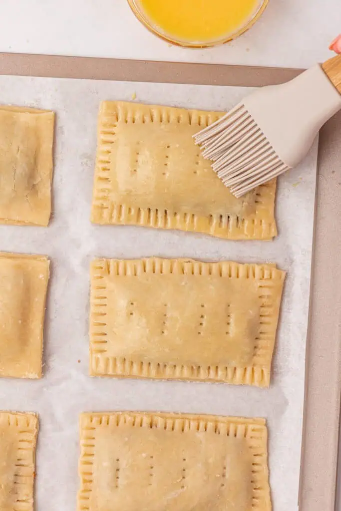 egg wash brushed on top of the pop tarts