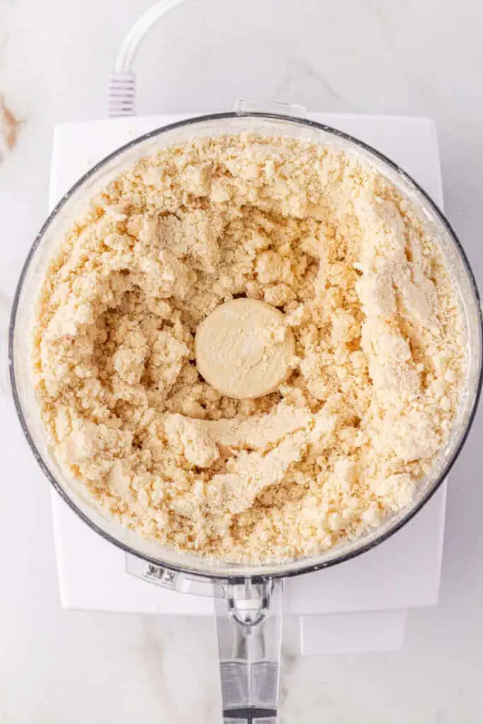 water added to pie crust mixture in food processor
