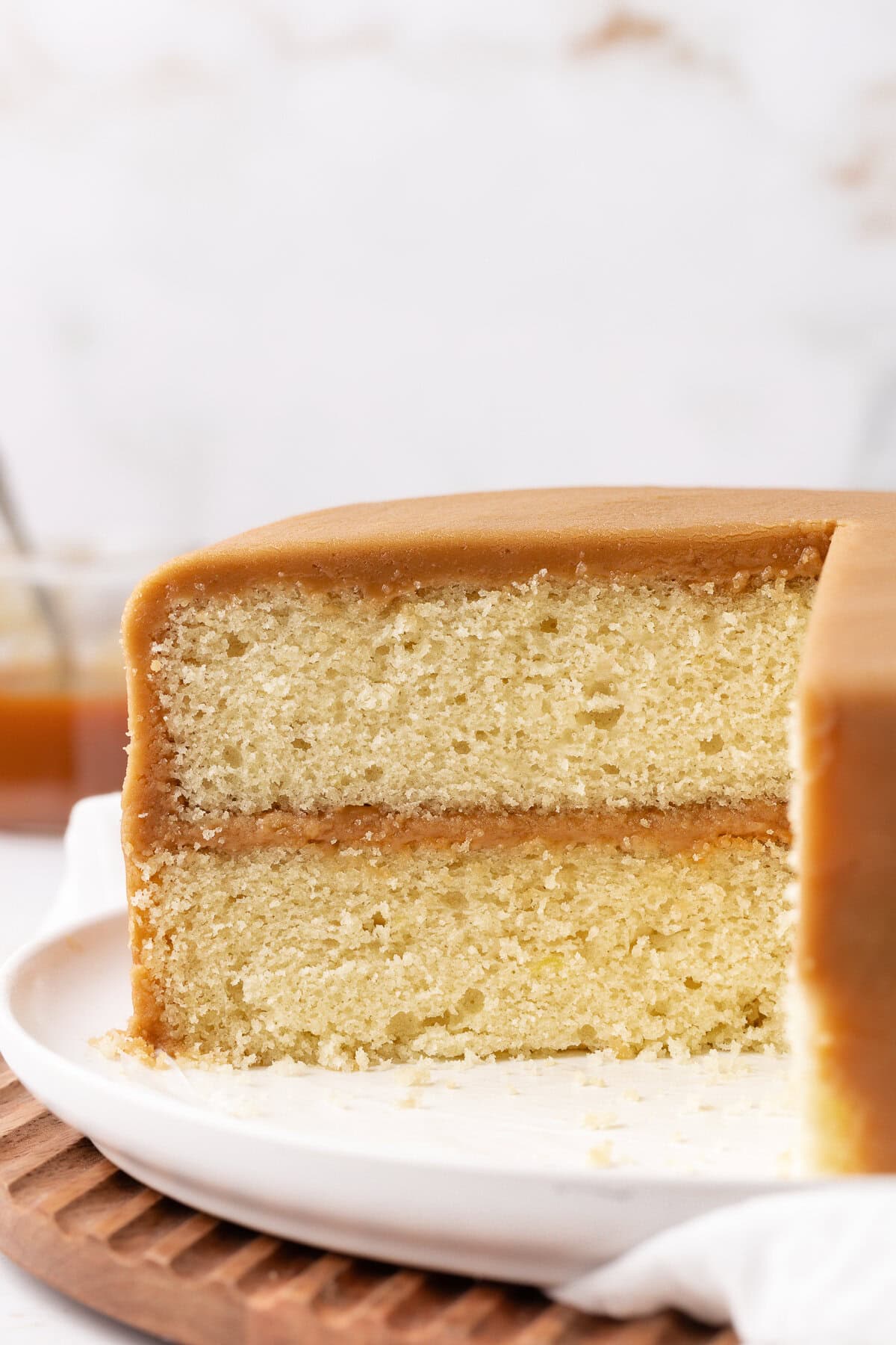 caramel cake cut away view on a cake stand