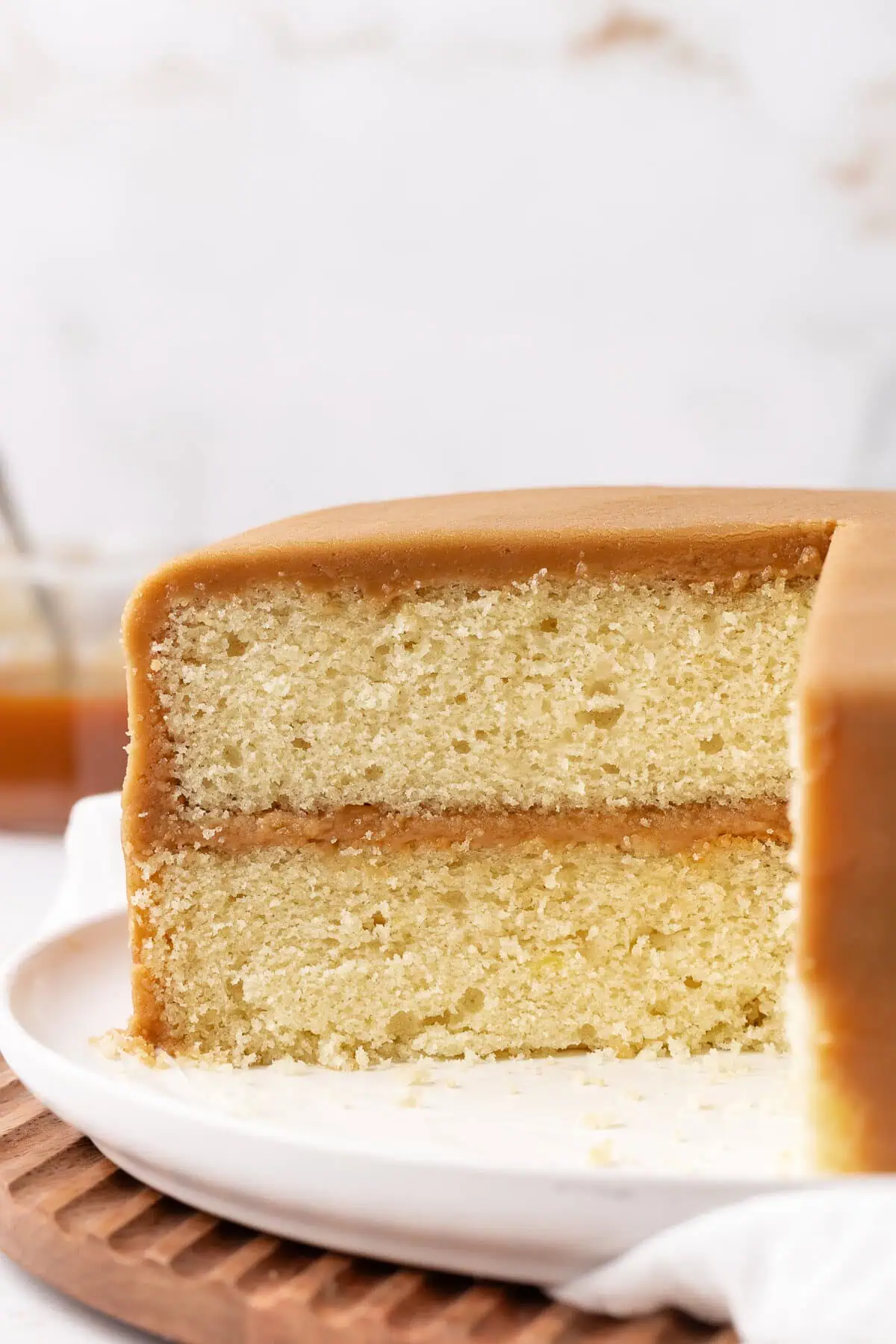 caramel cake cut away view on a cake stand