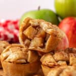 three mini apple pies stacked on top of each other