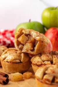 three mini apple pies stacked on top of each other