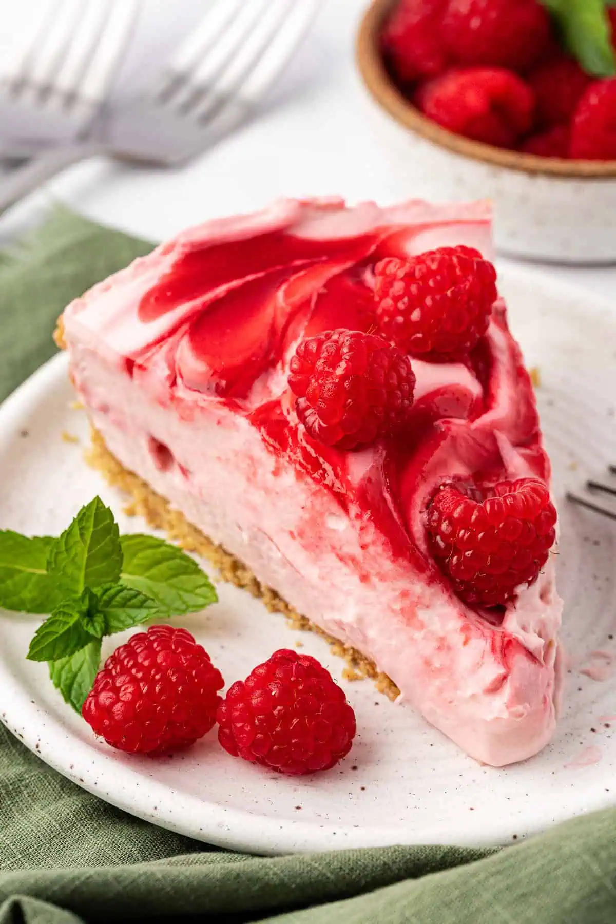 slice of no bake raspberry cheesecake