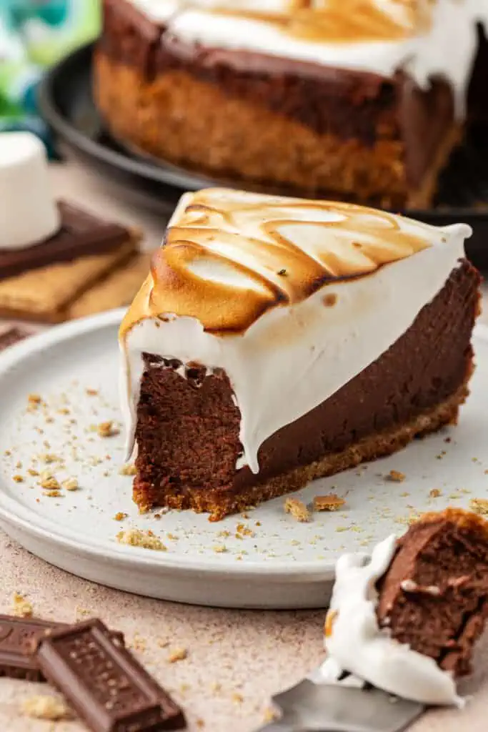 slice of smores cheesecake with a bite missing