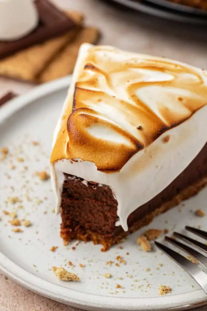 slice of smores cheesecake with a bite missing