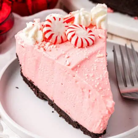 slice of no bake peppermint cheesecake on a plate