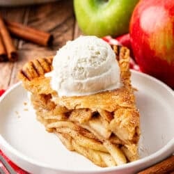 slice of apple pie topped with ice cream