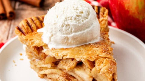 slice of apple pie topped with ice cream