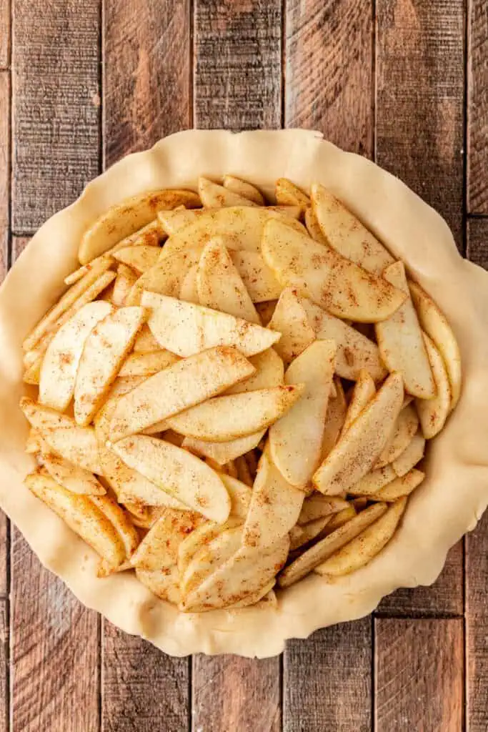 apples added to pie crust