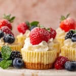 mini cheesecakes on a cake stand