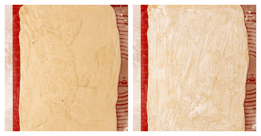 cinnamon roll dough rolled out and spread with butter